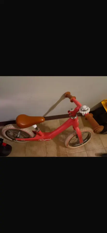 Red balance bike for child