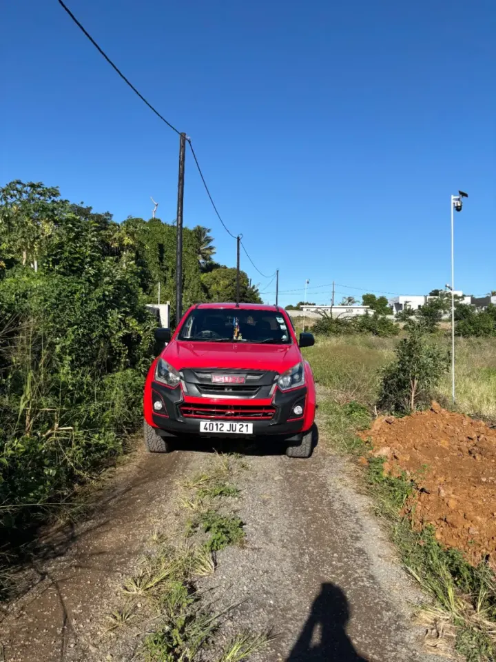 Red Isuzu D-Max Pickup Truck