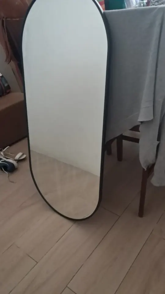 Large oval mirror on stand