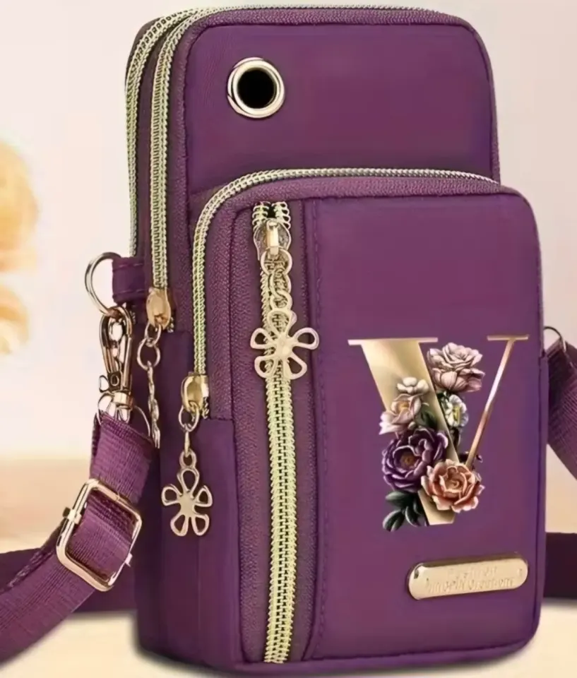 Small purple shoulder bag with gold zippers