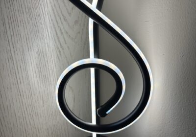 Stylish LED musical note lamp, black and white, modern decor for bedrooms or offices.