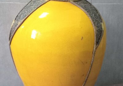 Yellow ceramic vase with ornate silver accents, traditional Mauritian style. Perfect for home decor or as a decorative piece.