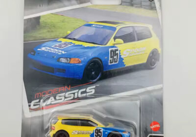 Hot Wheels Honda Civic EG toy car, blue and yellow, 1:64 scale, collectible model for racing enthusiasts.