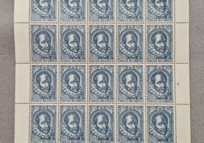 Vintage blue postage stamps featuring a profile of a historical figure, arranged in a sheet.