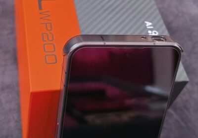 Wireless Bluetooth speaker in orange and gray, compact and portable, ideal for outdoor use.