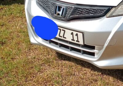 Honda Civic silver front view with Mauritius license plate ZZ 11, parked on grass.