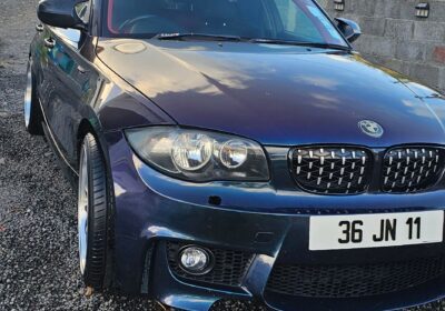 BMW 3 Series Sedan in dark blue, compact luxury car, front view with license plate 36 JN 11.