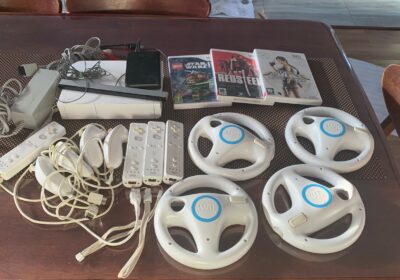 Wireless gaming controllers with motion sensors and remote controls, white color, for Nintendo Wii console.