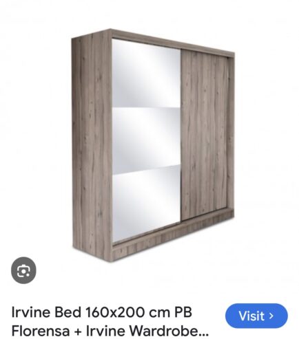 Wardrobe with sliding doors and mirror