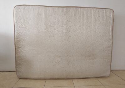 Comfortable beige mattress, standard size, suitable for bedroom use.